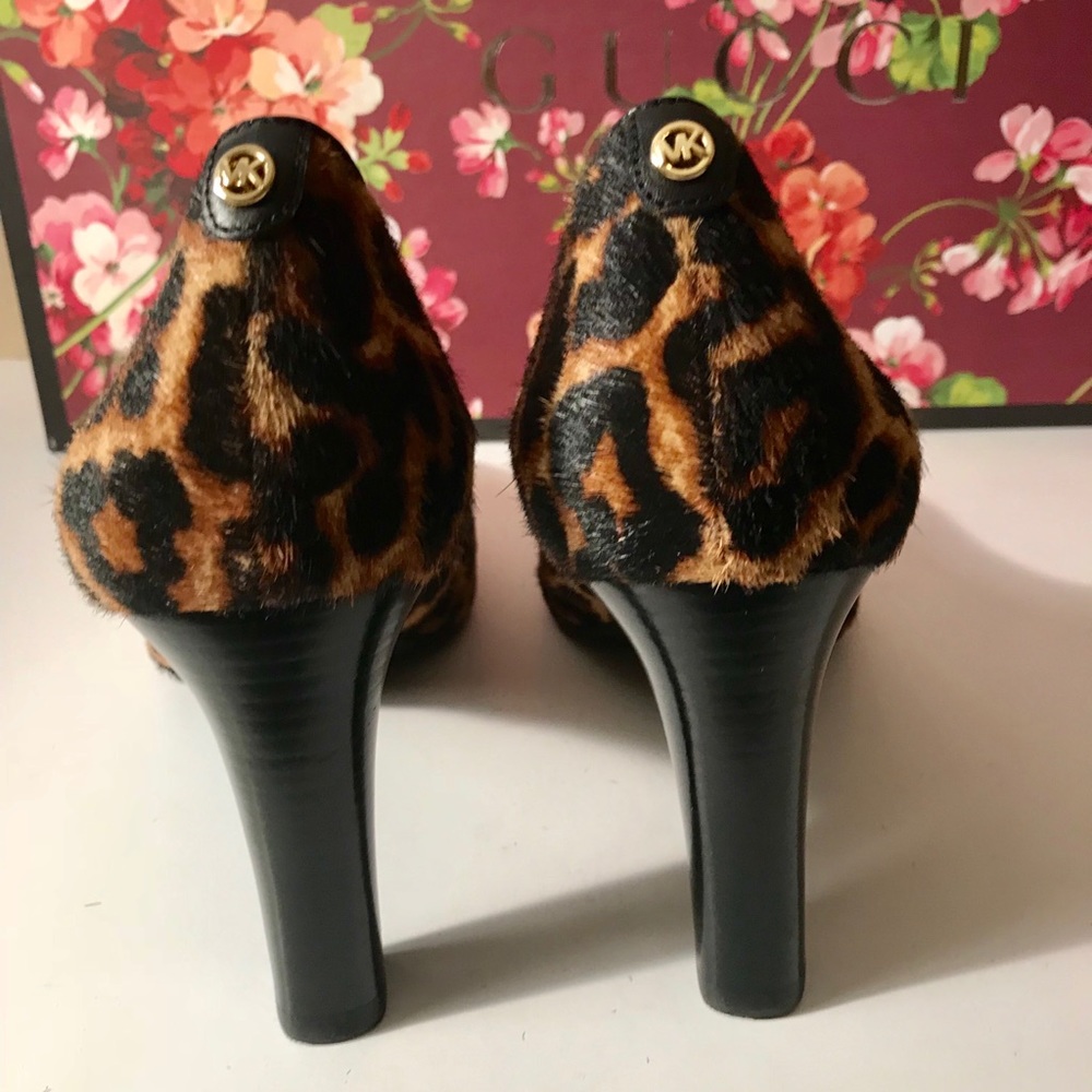 Michael Kors Calf hair leopard pumps.